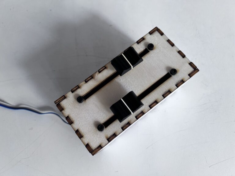 First interactive device with two slide potentiometers